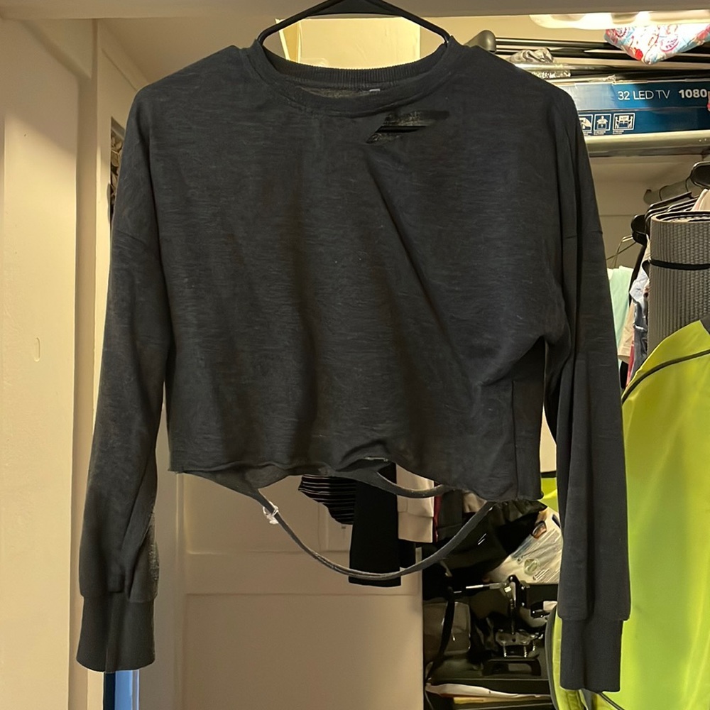 Long sleeve ripped cropped shirt. Size small. Great condition